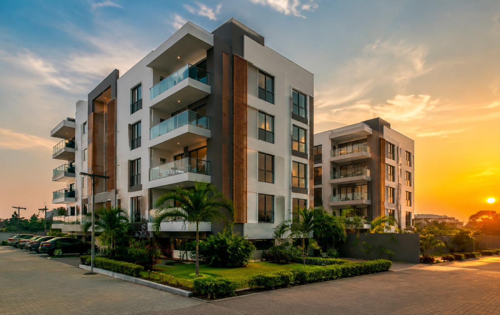 Modern apartment buildings with balconies at sunset